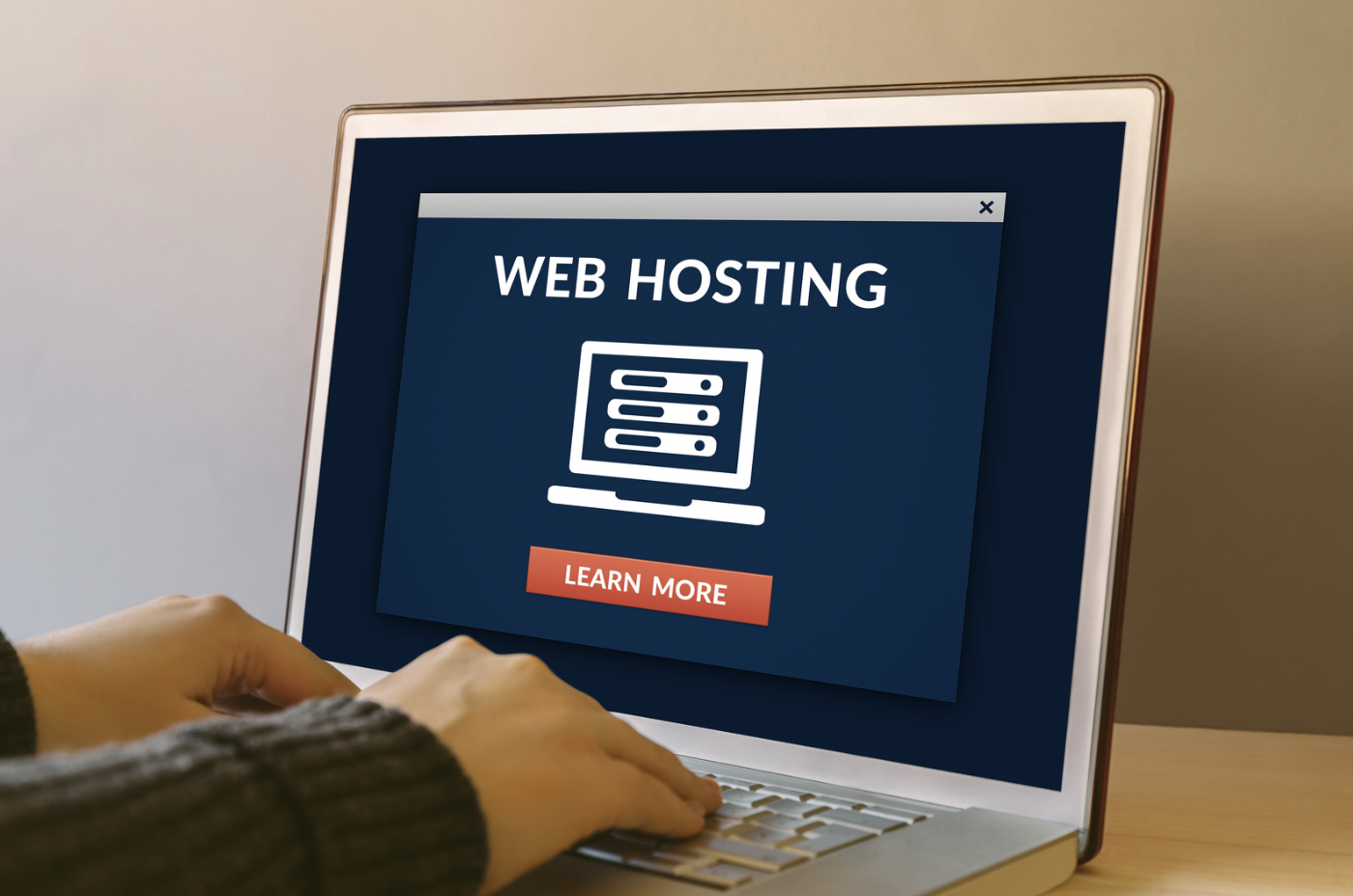 person typing webhosting on laptop